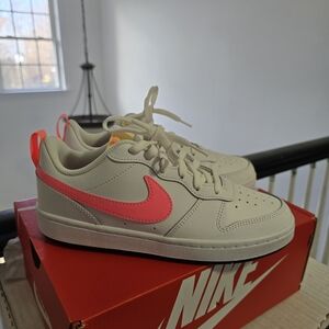 Nike Sneakers with Pink Swoosh